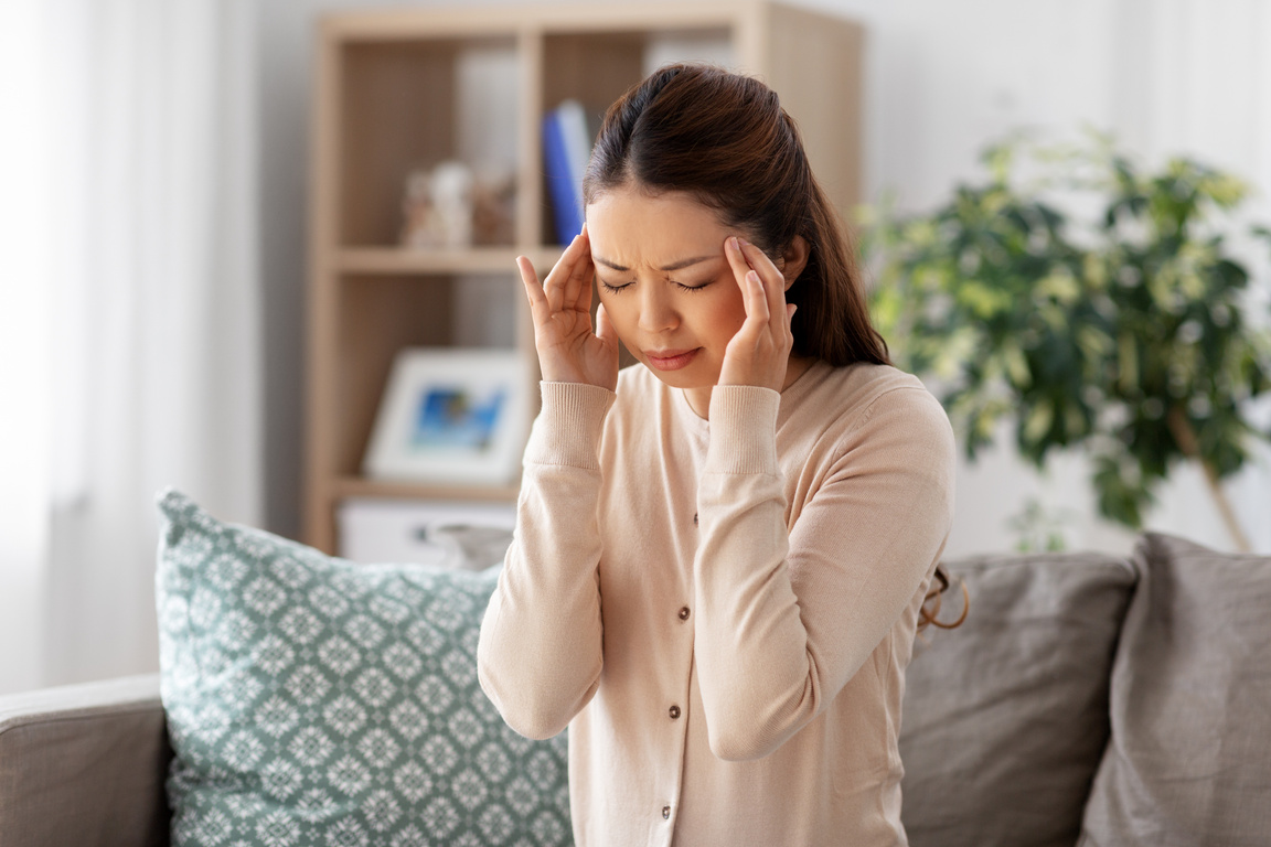 Sick Asian Woman Having Headache at Home